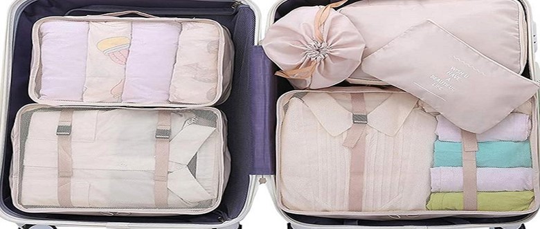 از تقسیم‌کننده فضای چمدان برای بستن چمدان های مسافرت استفاده کنید